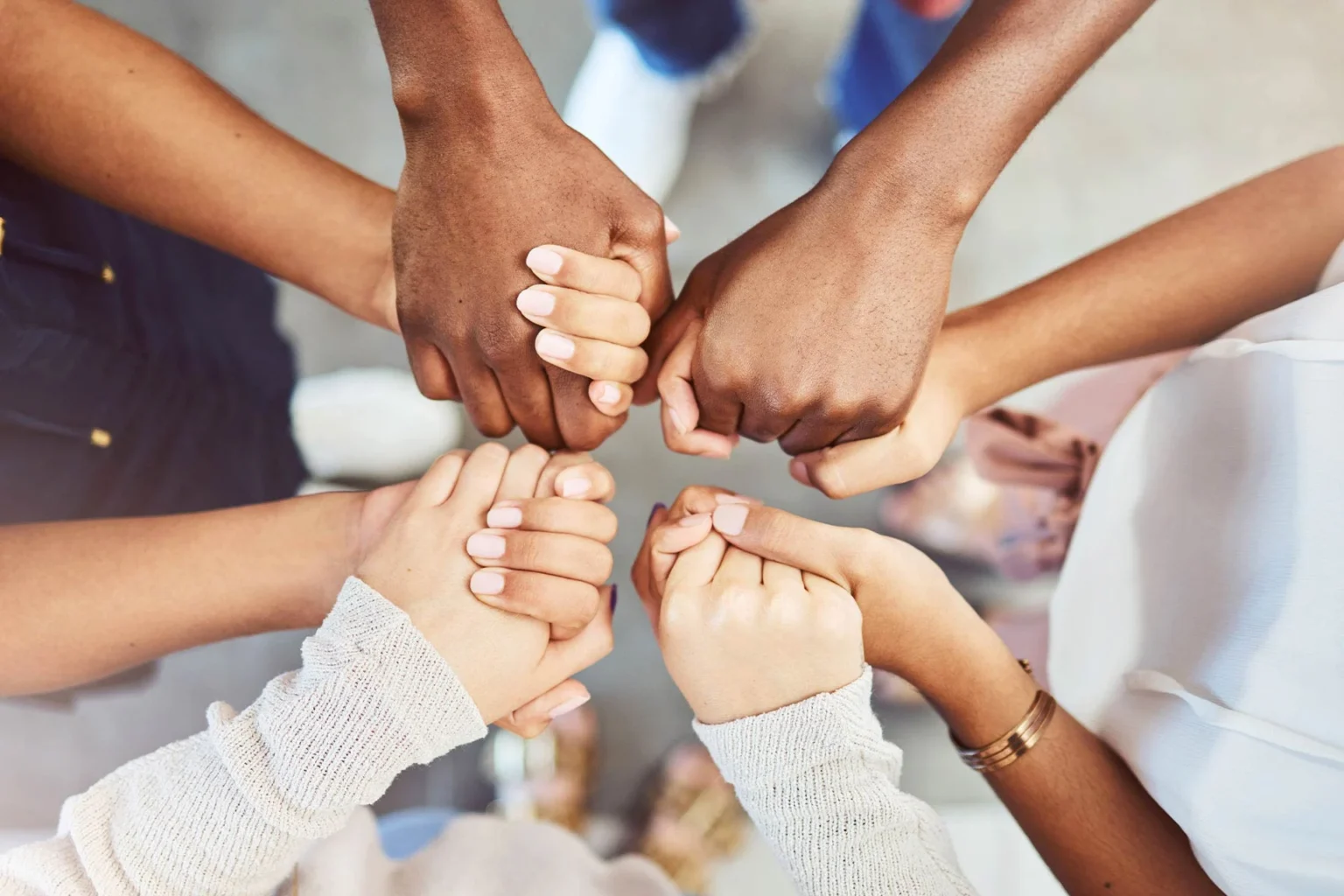Hands clasped in a circle